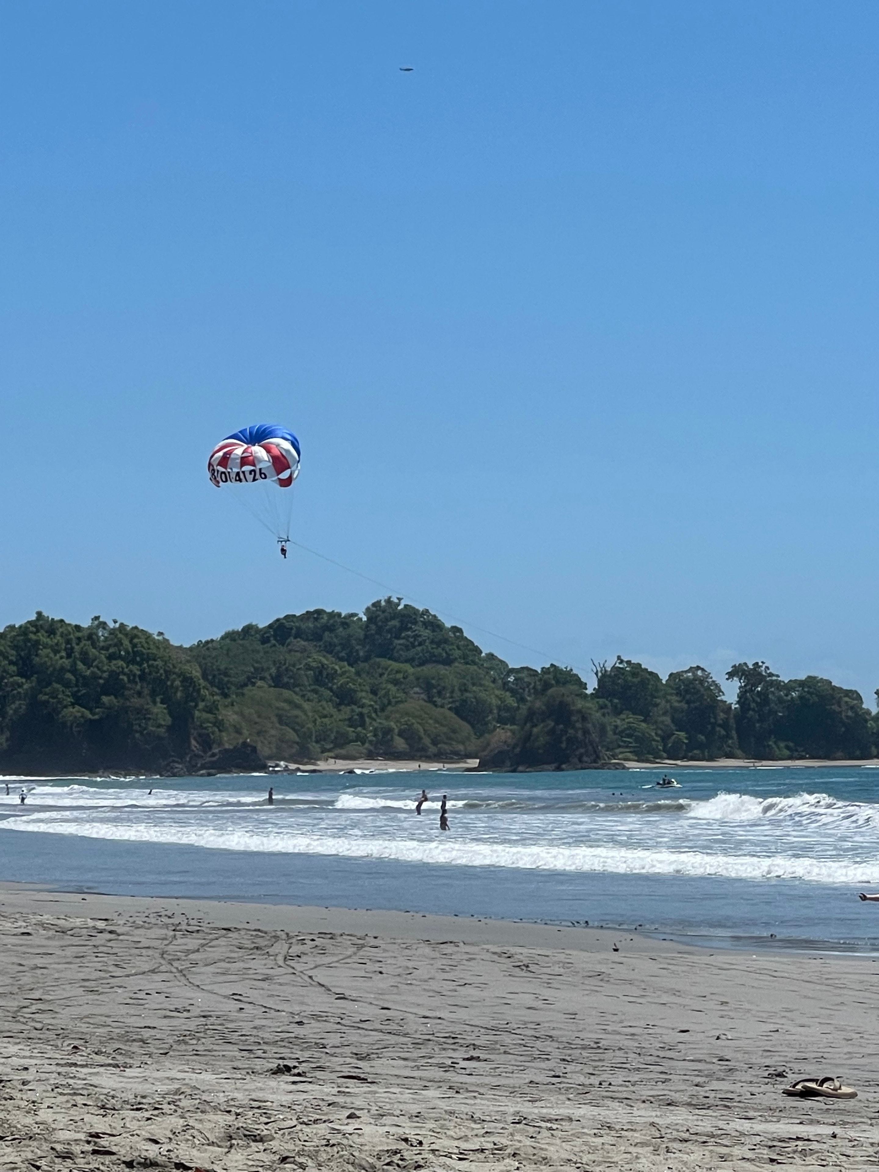 Parasailing over the Pacific coast near Quepos, Costa Rica
